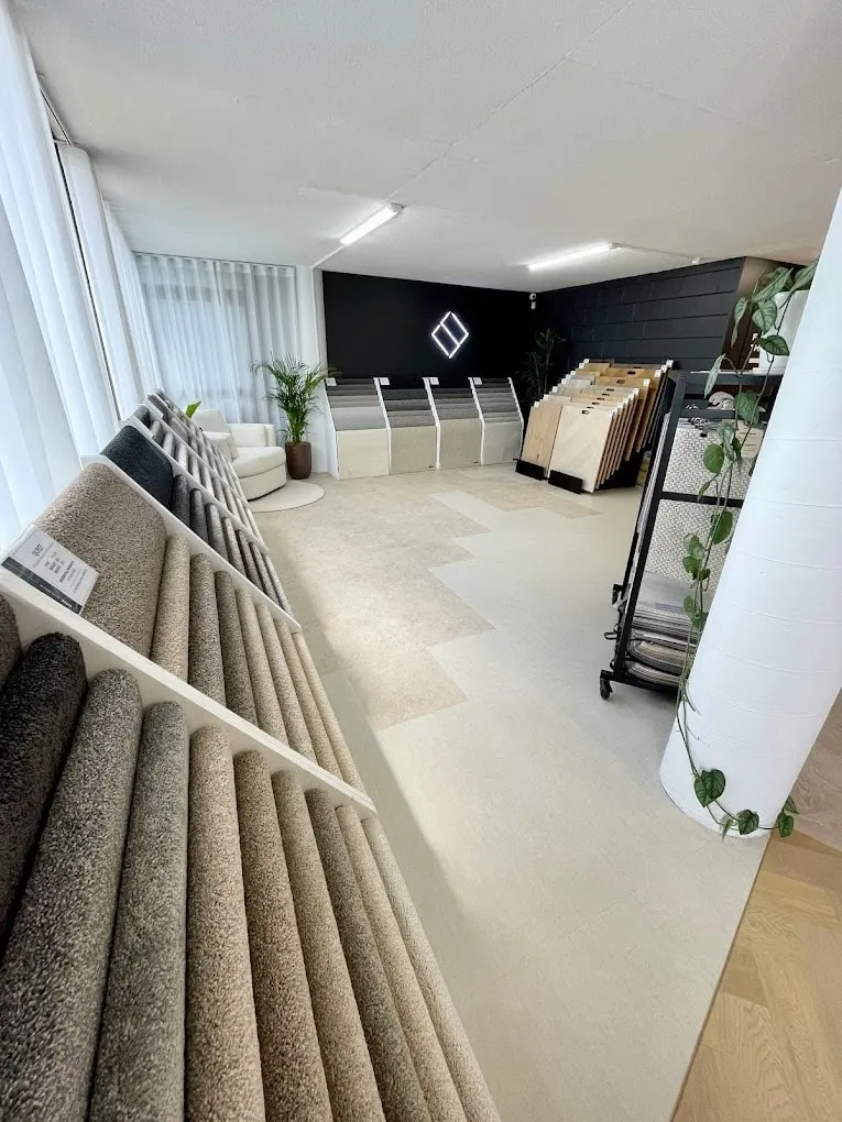 Carpet sample stands inside the One Source Floors showroom