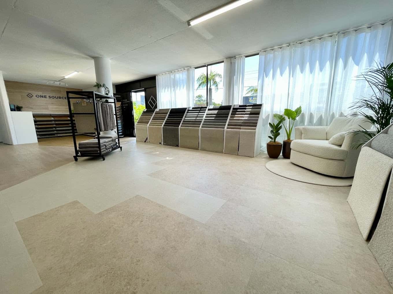 Open showroom floor with flooring displays at One Source Floors