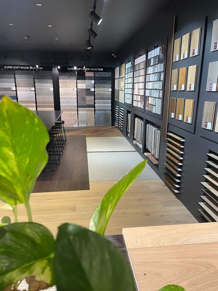 Timber and carpet samples on the wall at One Source Floors