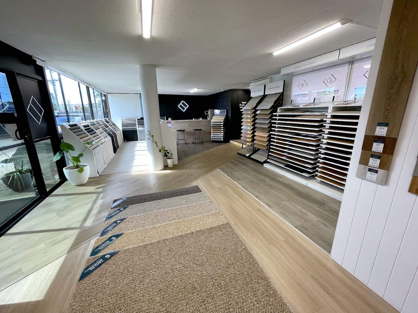Flooring sample racks in the One Source Floors showroom