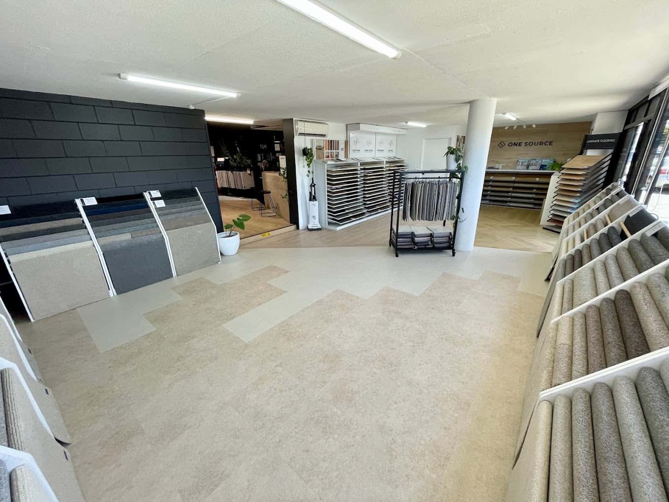 Carpet and hybrid flooring displays at One Source Floors, Nerang