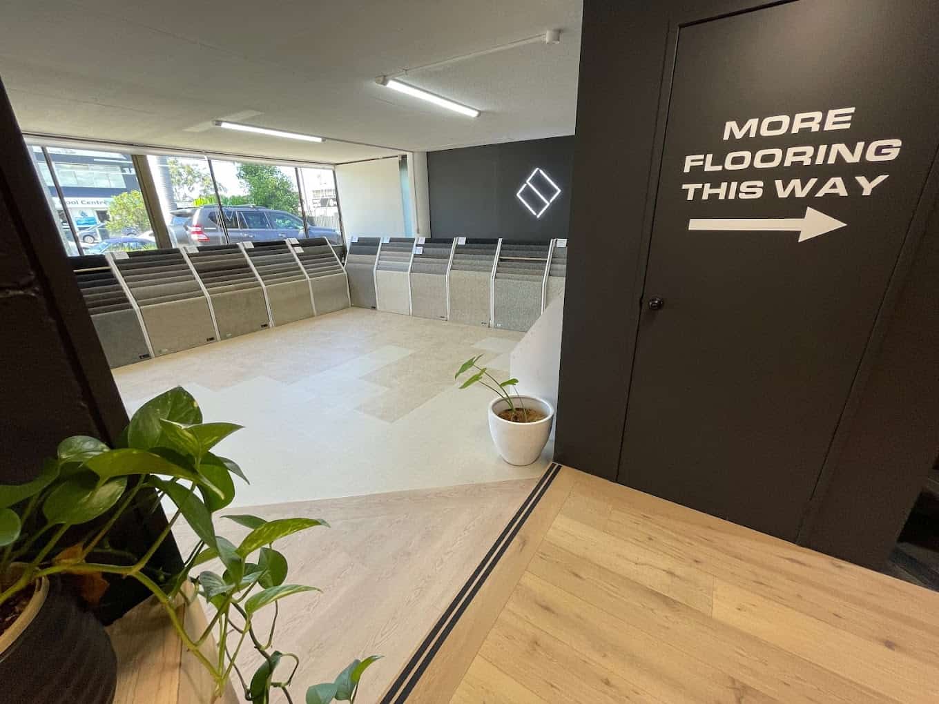 Hybrid and vinyl flooring displays inside the One Source Floors showroom